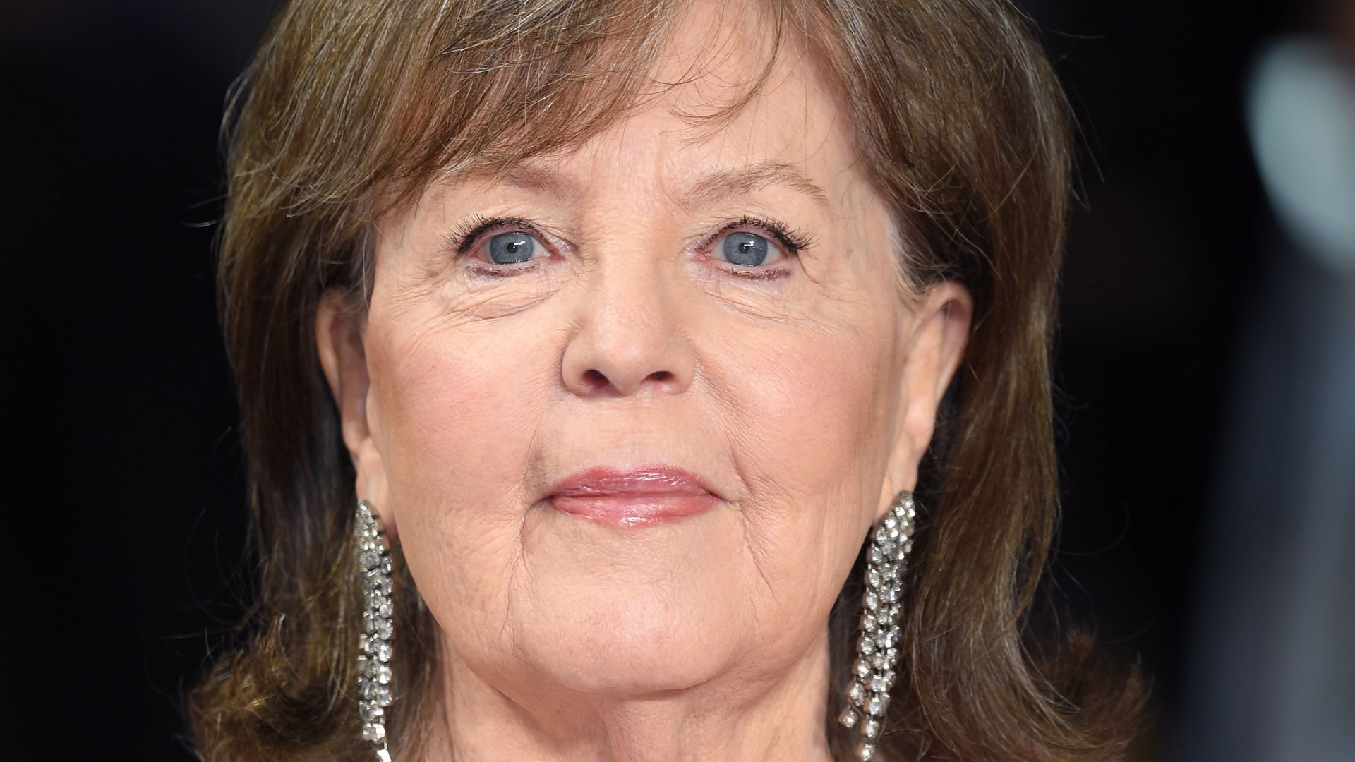 Pauline Collins wearing a white floral blouse while attending the World Premiere of 'The Time Of Their Lives' in 2017. 