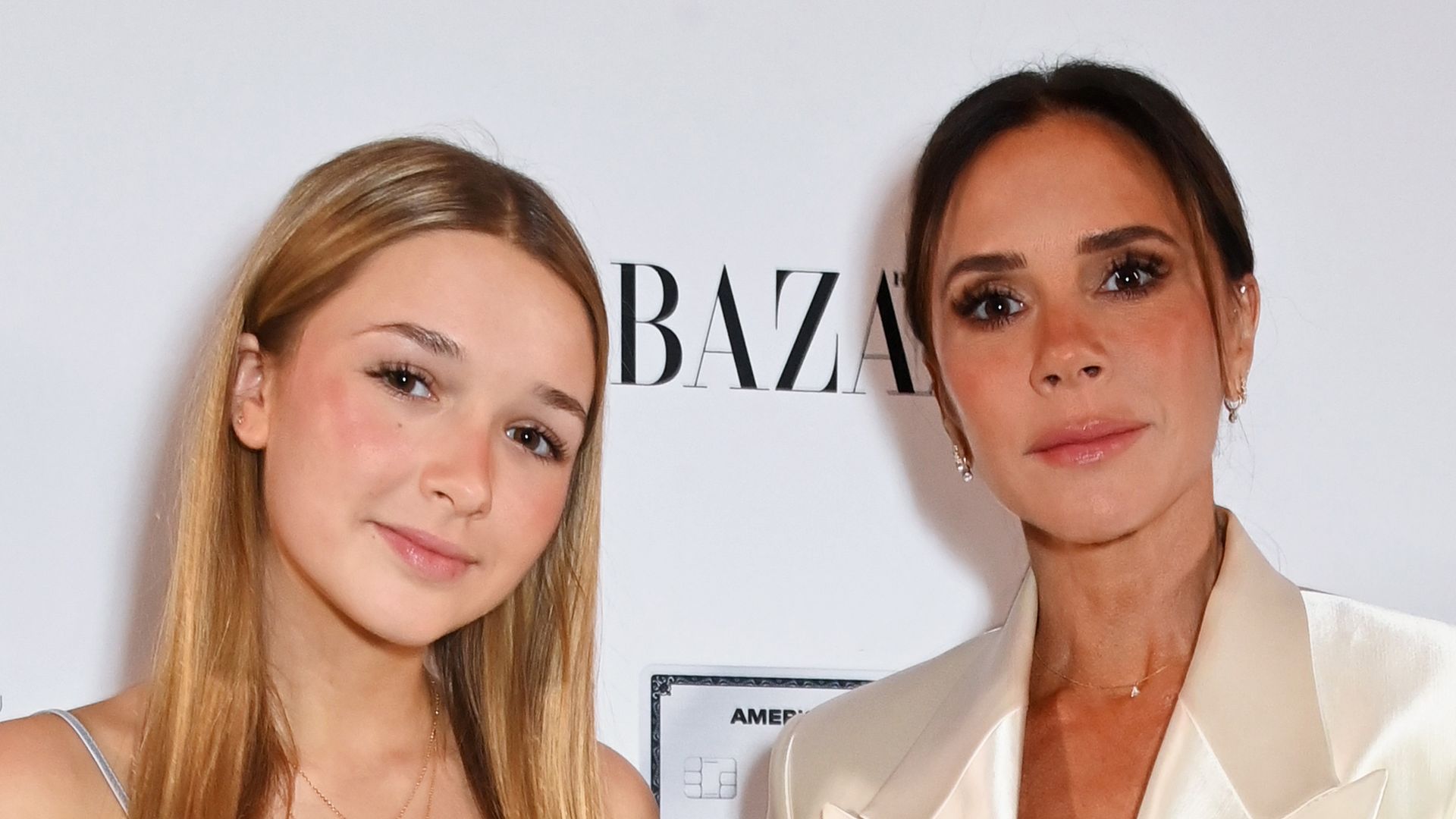 Harper Beckham debuts new hair as she twins with mother Victoria in silk dresses 