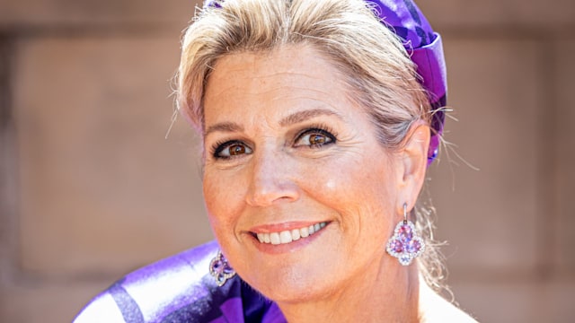 Queen Maxima in purple dress and headpiece