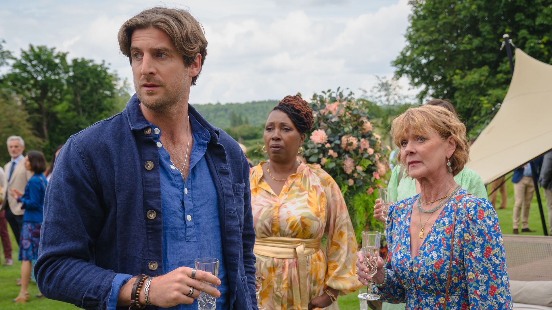 Three people at garden party