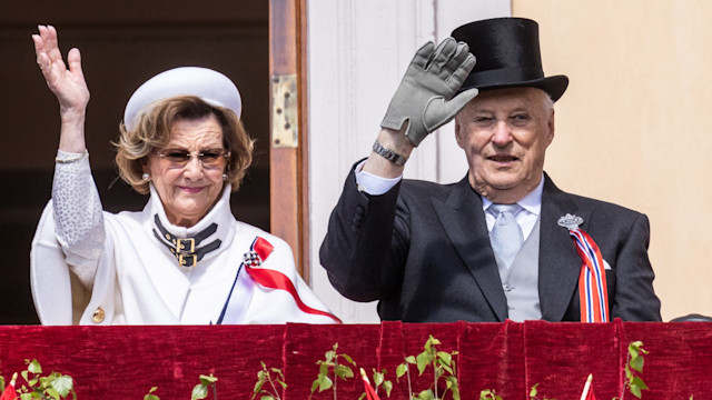 Queen Sonja and King Harald attend the children's parade at the Royal Castle on Norway's National Day