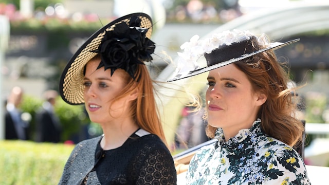 Princess Beatrice in a black dress and Princess Eugenie in a floral dress - both are riding in a carriage