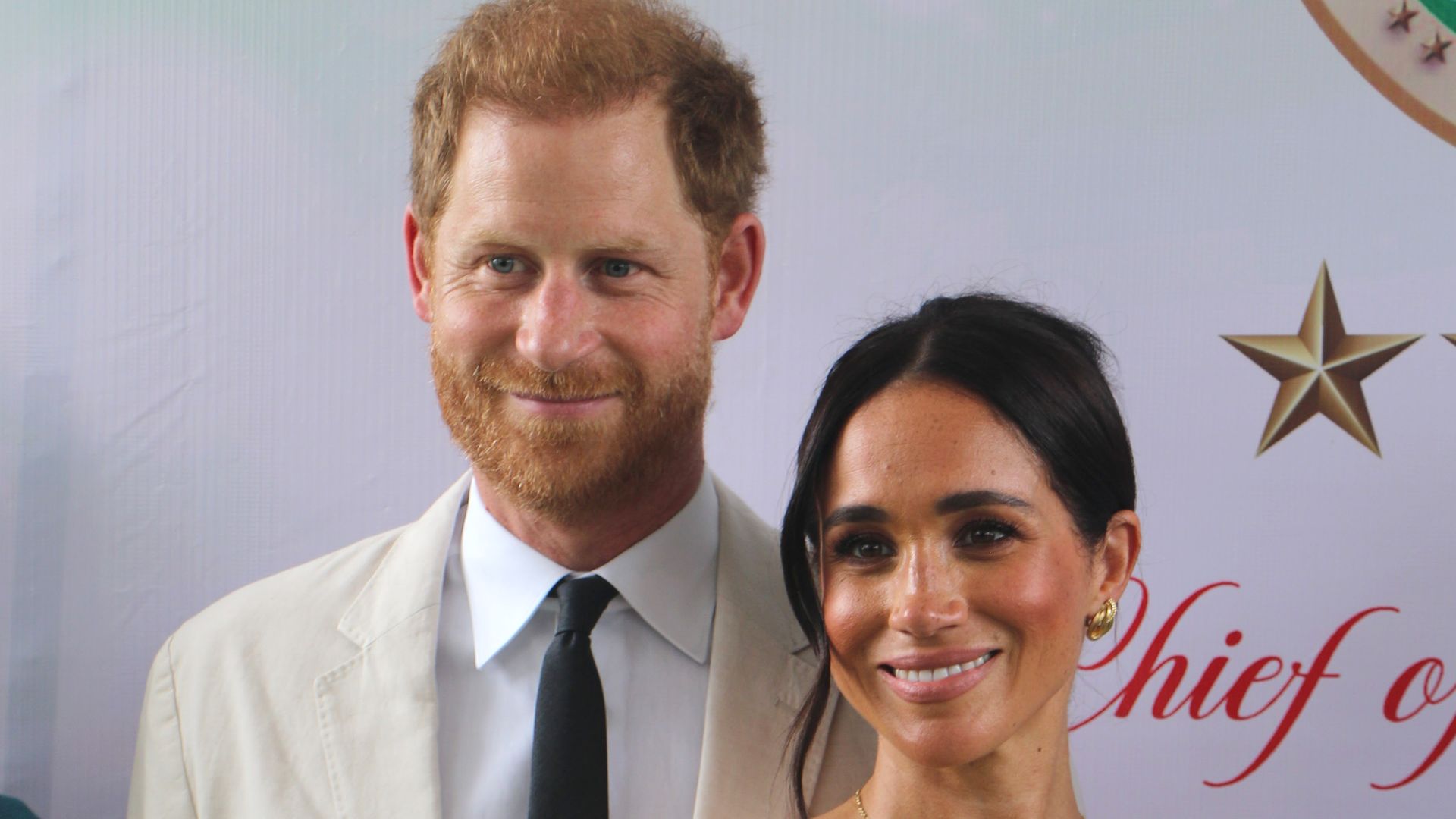 Prince Harry and Meghan Markle pose for a photo