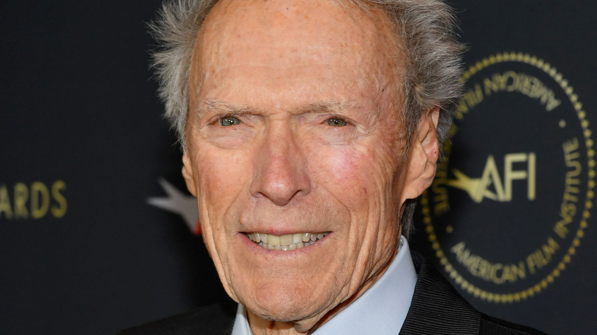 Clint Eastwood in dark suit 