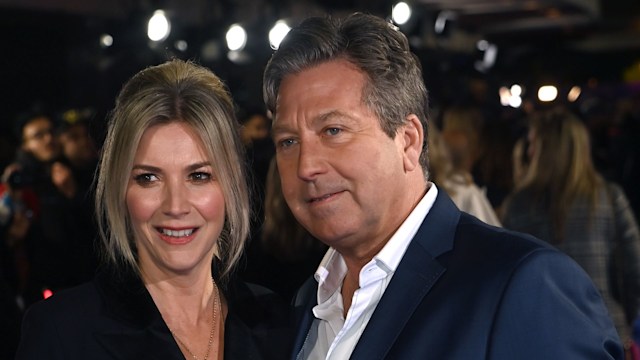 Lisa Faulkner in a black dress and John Torode in a blue suit