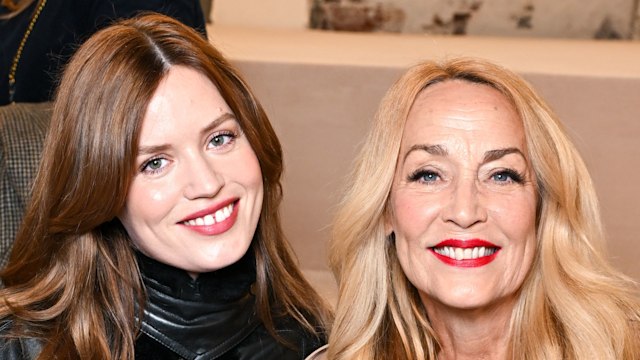 mother and daughter posing at fashion show