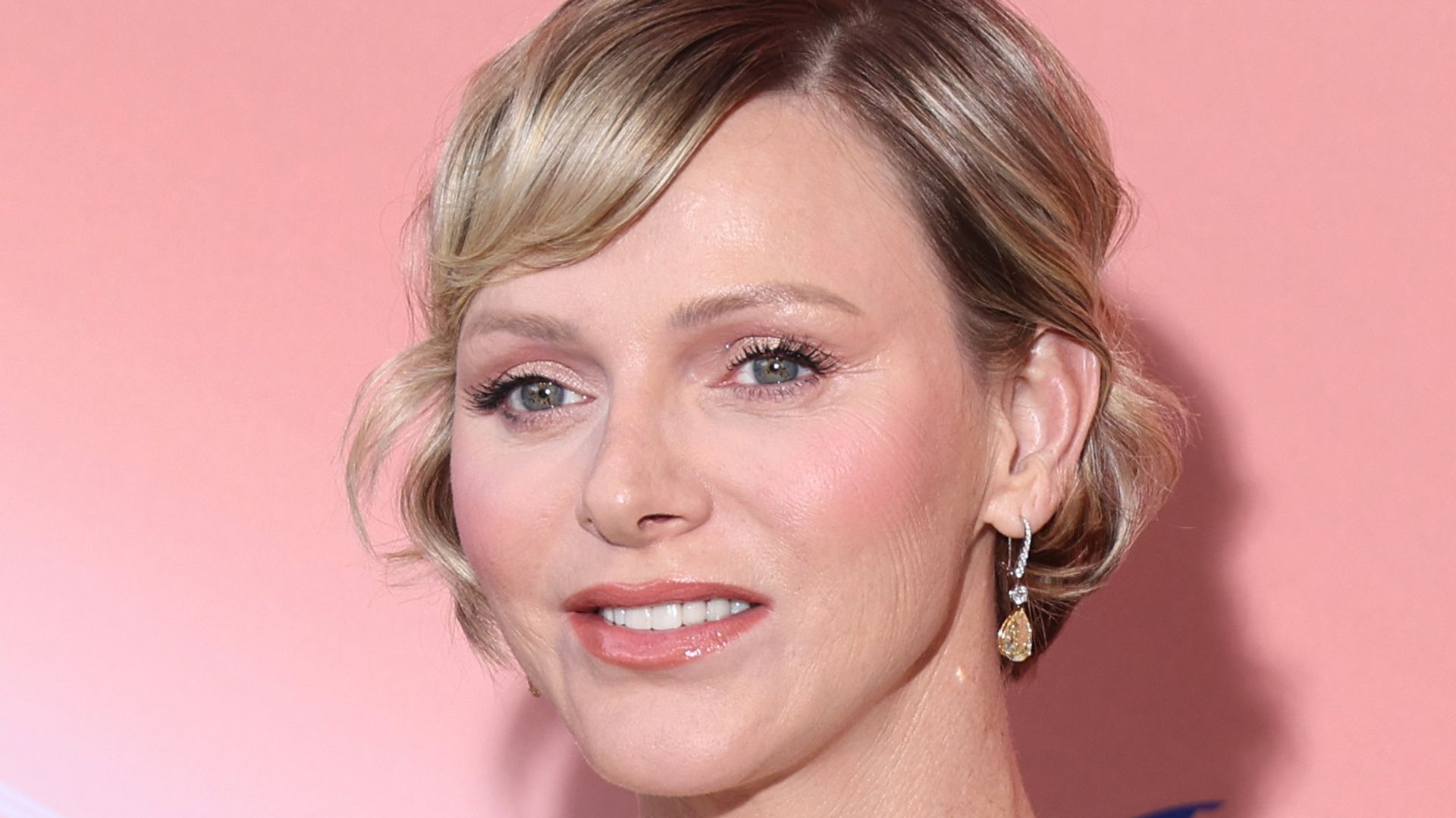 prince albert in black tie beside princess charlene in white gown
