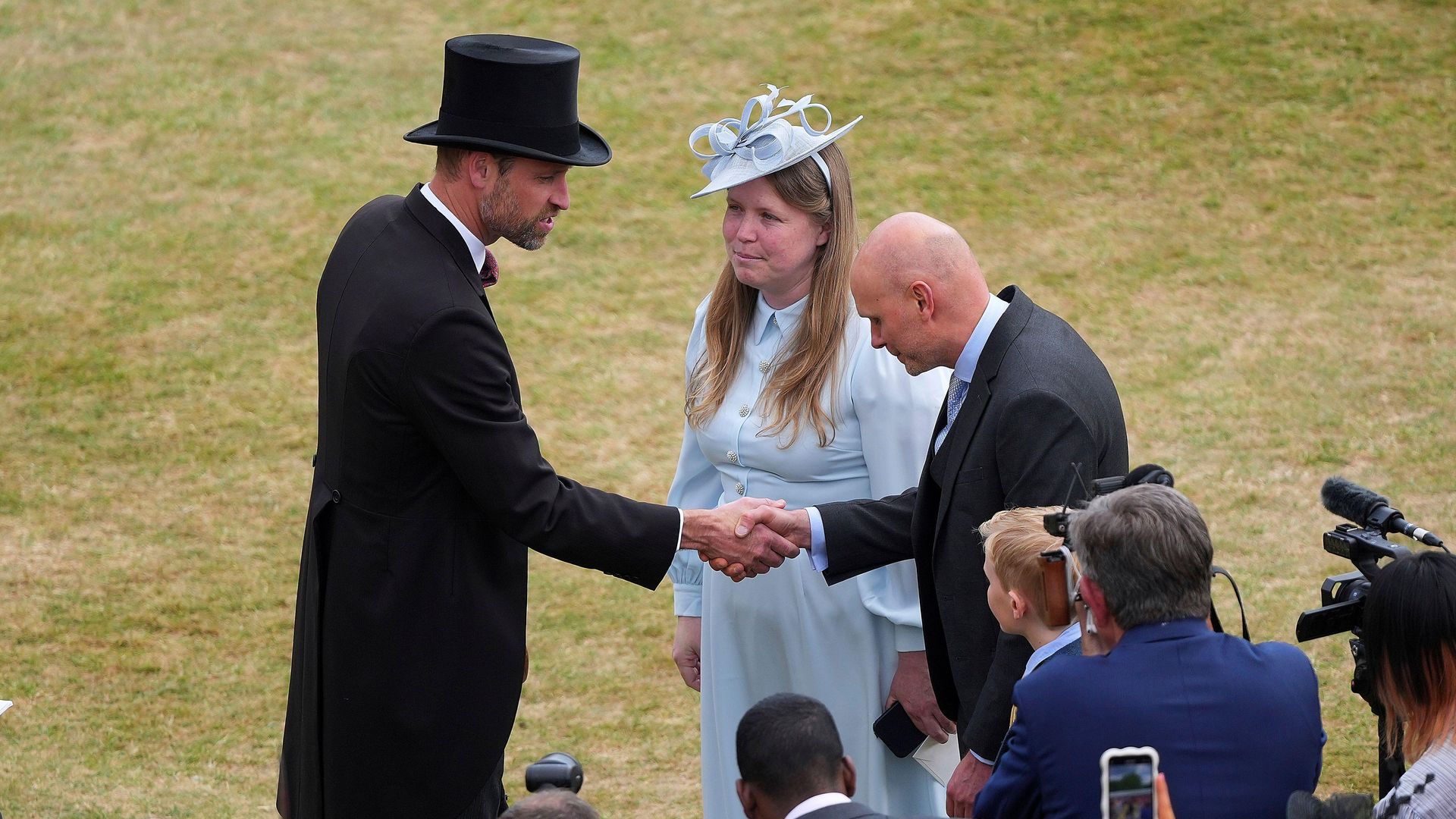 Prince William with the family of talented teenage photographer Liz Hatton.