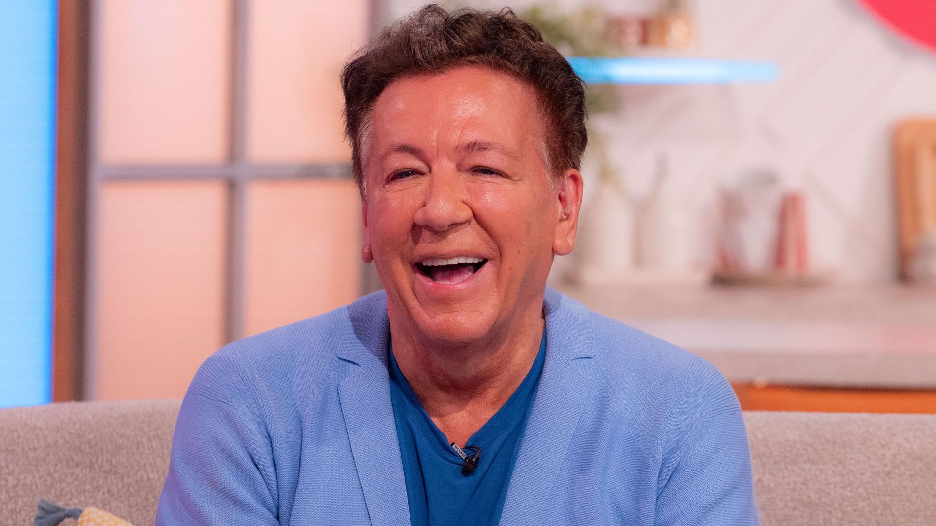 Ross King smiling in a blue shirt