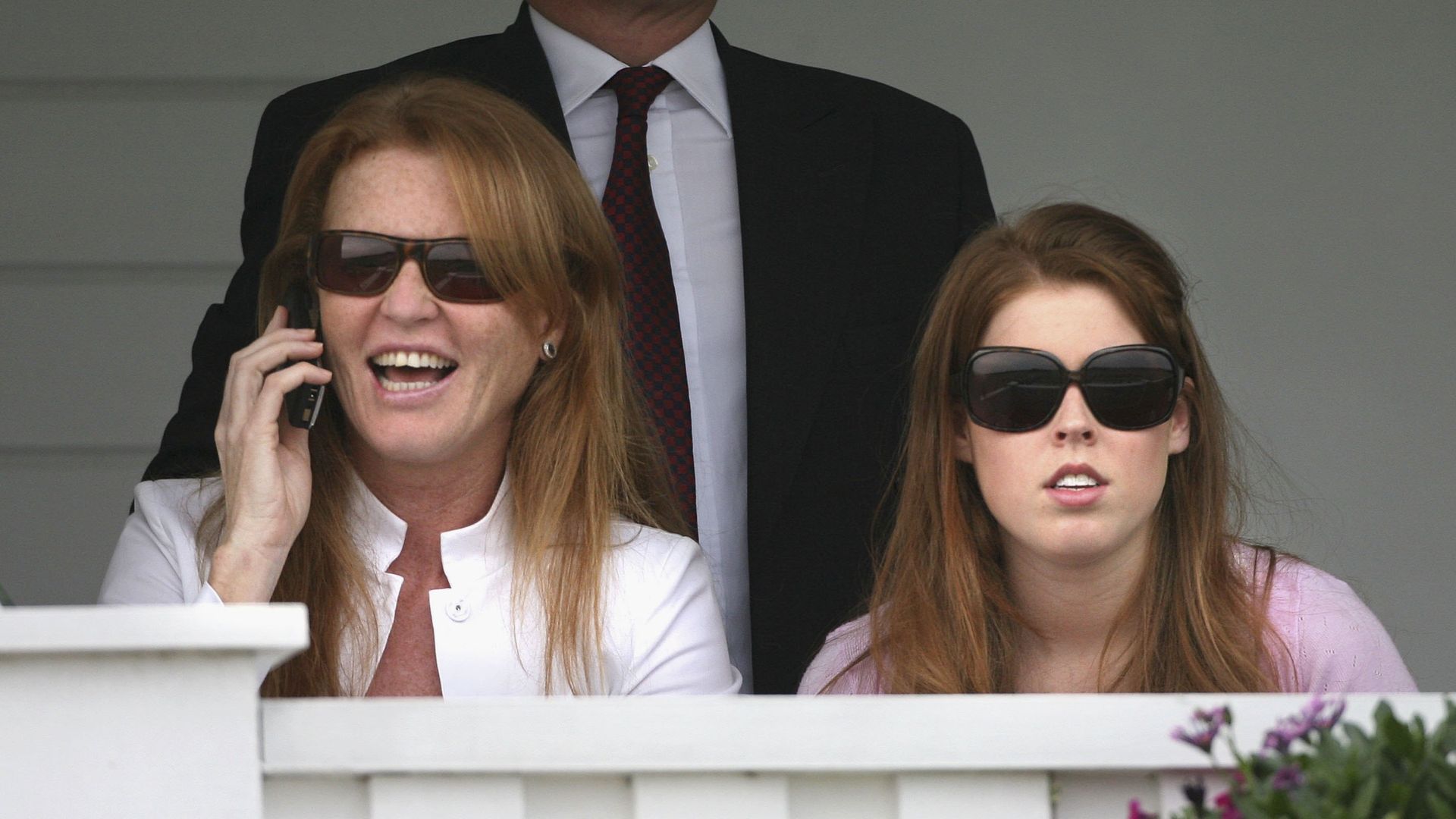 two women watching tennis game 