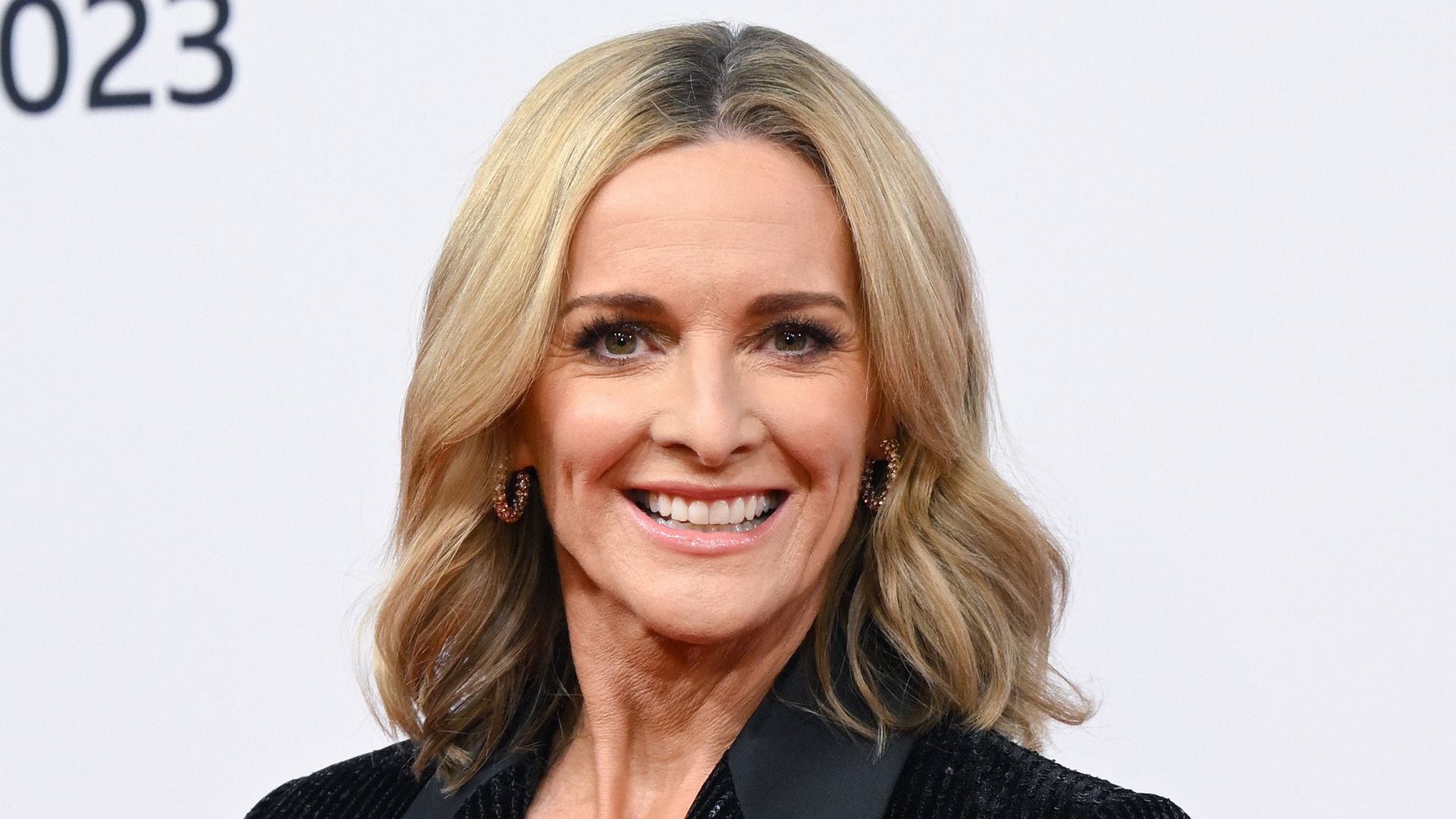 Gabby Logan in a black sparkly suit