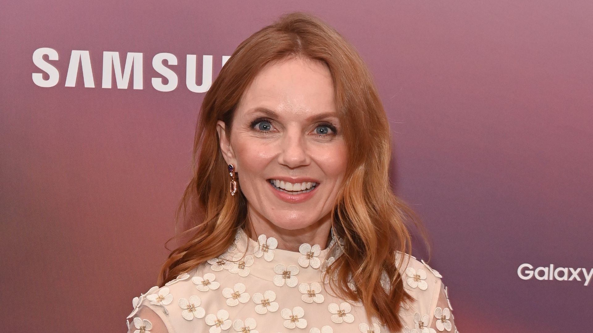 Geri Halliwell-Horner in white sheer dress covered with flowers