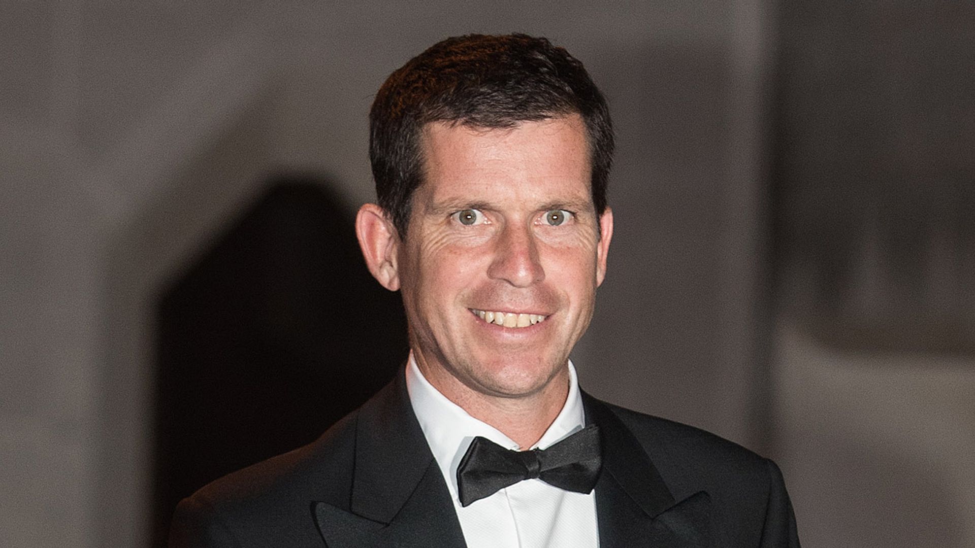 Tim Henman wearing a black tuxedo