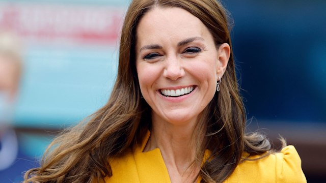 The Princess of Wales smiles wearing a yellow