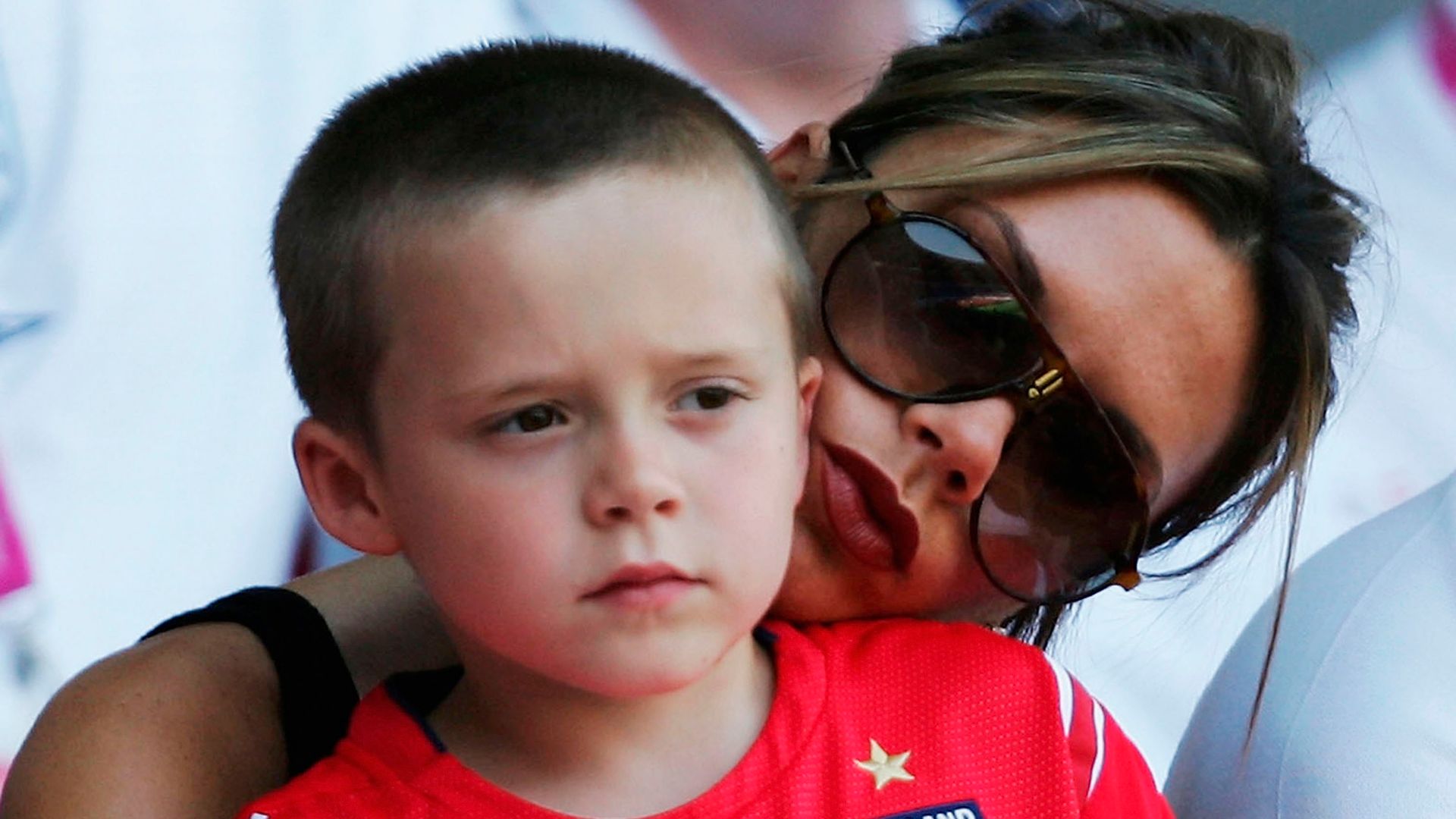 Victoria Beckham with her son Brooklyn in 2004
