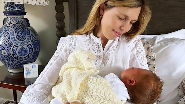 woman holding baby 