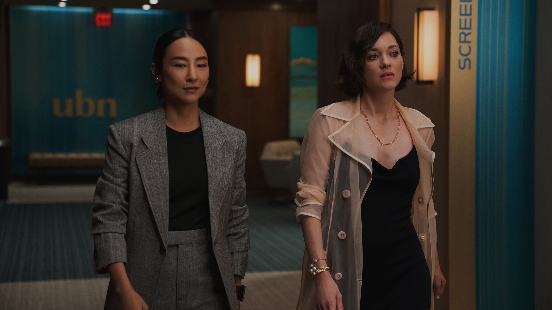 two women walking down hall