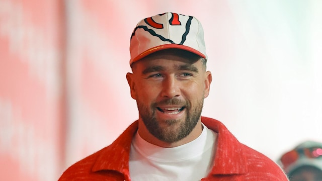 Travis Kelce #87 of the Kansas City Chiefs walks into the stadium at GEHA Field at Arrowhead Stadium prior to the game against the Denver Broncos on November 10, 2024 in Kansas City, Missouri.