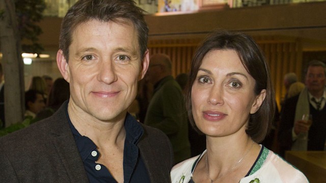 Ben Shephard in a blue shirt with his wife Annie in a white cardi