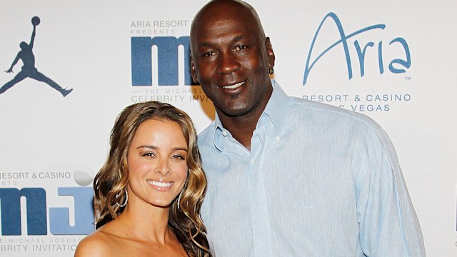 Michael Jordan and his wife Yvette Prieto smiling at a red carpet event