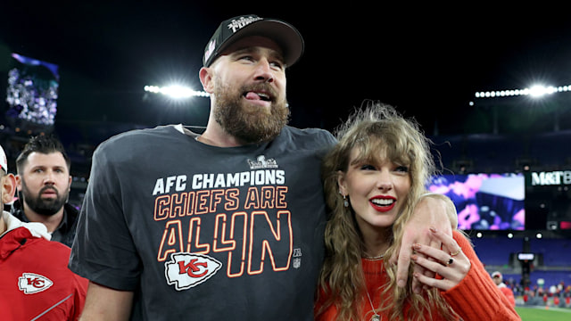 Travis Kelce #87 of the Kansas City Chiefs celebrates with Taylor Swift after the AFC Championship Game