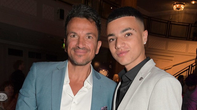 Peter Andre with his arm around Junior Andre