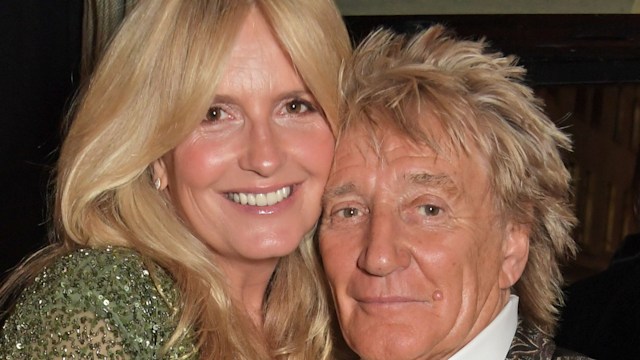 Penny Lancaster and Sir Rod Stewart standing close together 