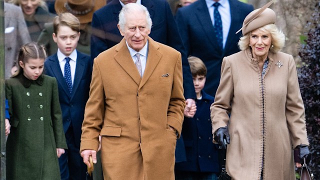 King Charles walking in front of Prince William, Prince George, Princess Charlotte and Prince Louis