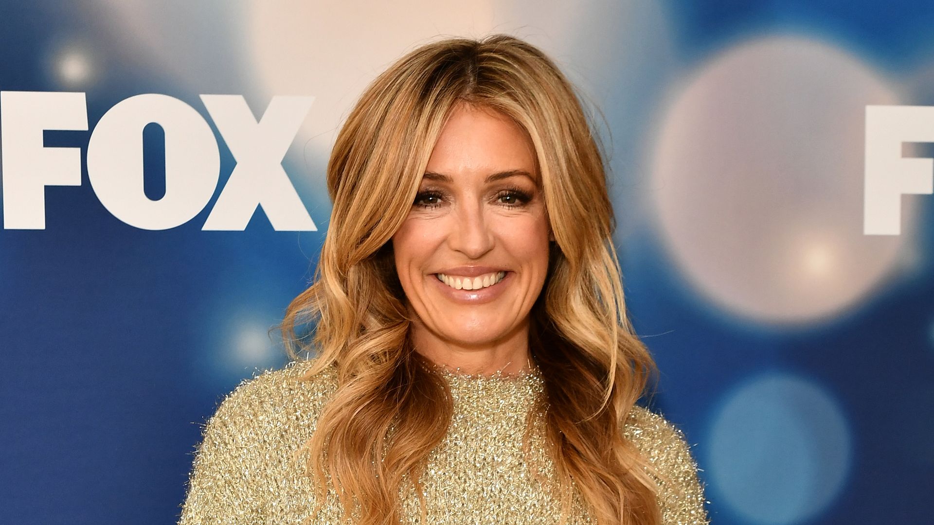 Cat Deeley in gold sparkly top
