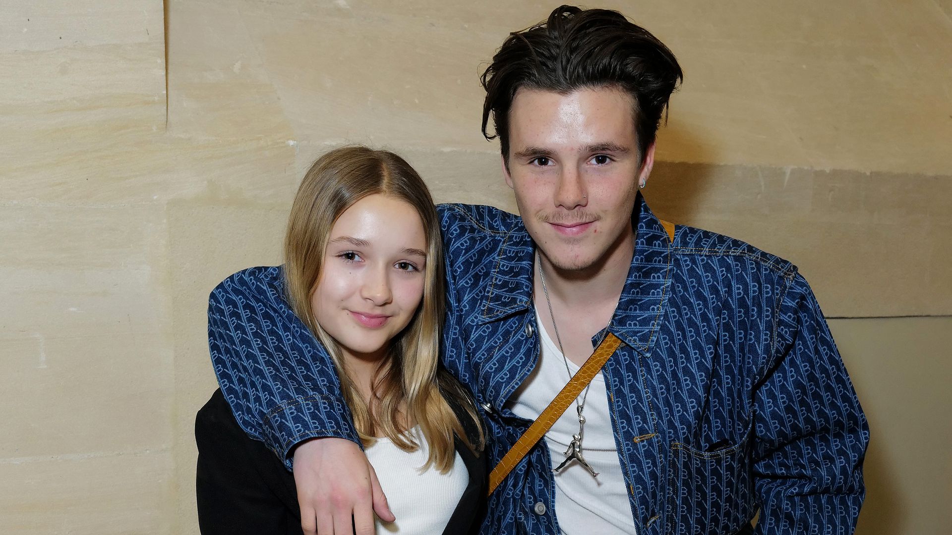 PARIS, FRANCE - MARCH 03: (L-R) Harper Beckham and Cruz Beckham attend the Victoria Beckham FW23 show during Paris fashion week on March 03, 2023 in Paris, France. (Photo by Darren Gerrish/WireImage for Victoria Beckham)