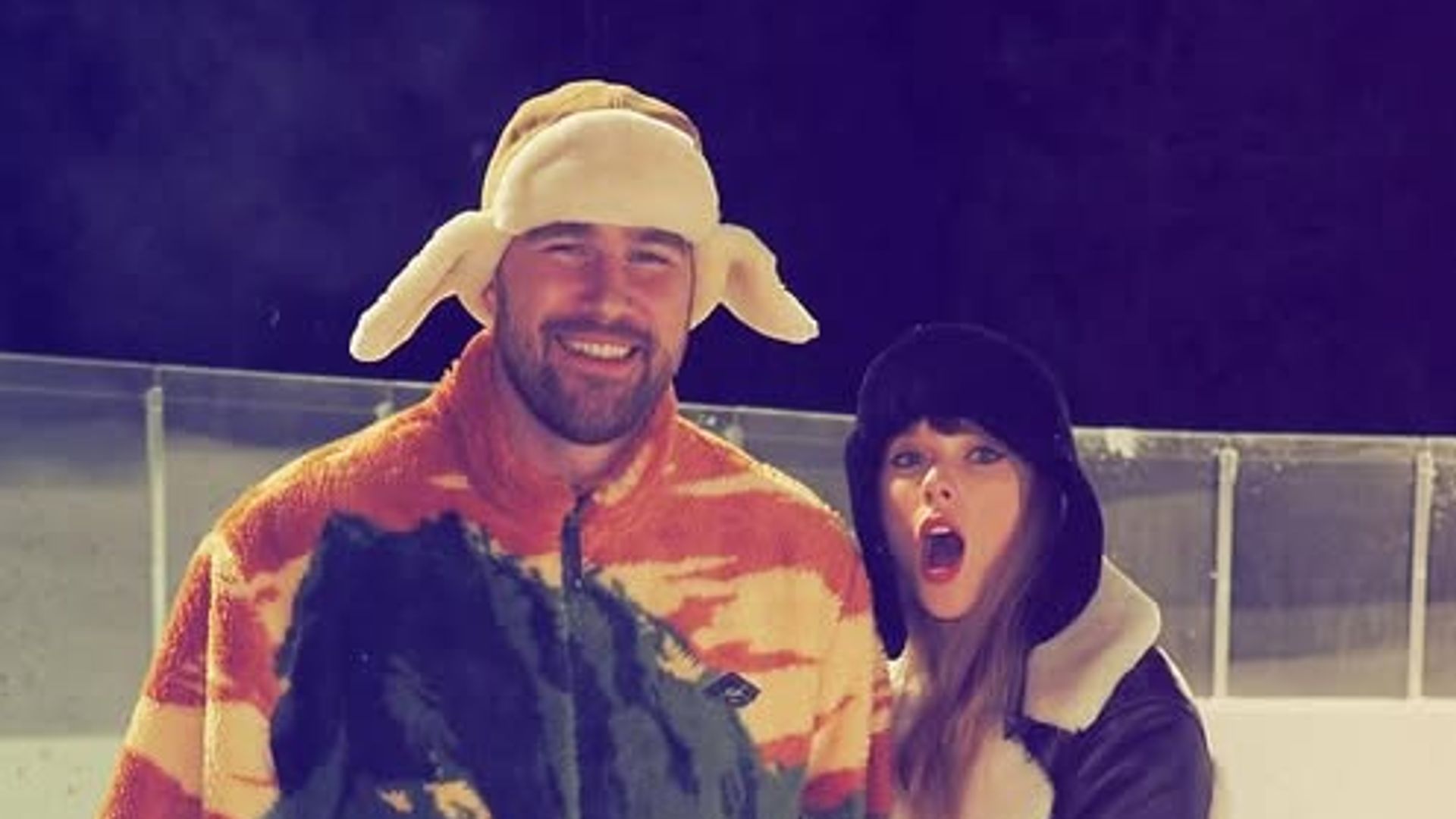 Traivs Kelce and Taylor Swift pose on an ice rink