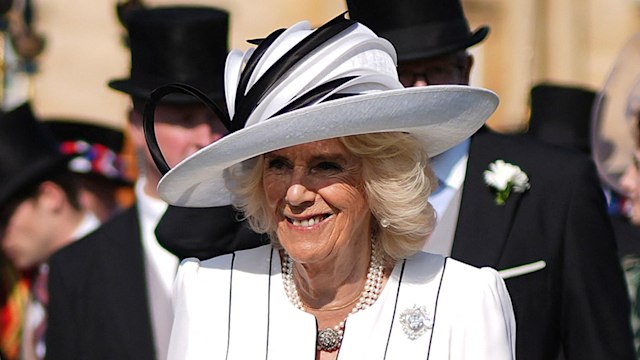 King Charles III and Britain's Queen Camilla attend a Royal Garden Party at Buckingham Palace, central London, on May 8, 2024. (Photo by Jordan Pettitt / POOL / AFP) (Photo by JORDAN PETTITT/POOL/AFP via Getty Images)