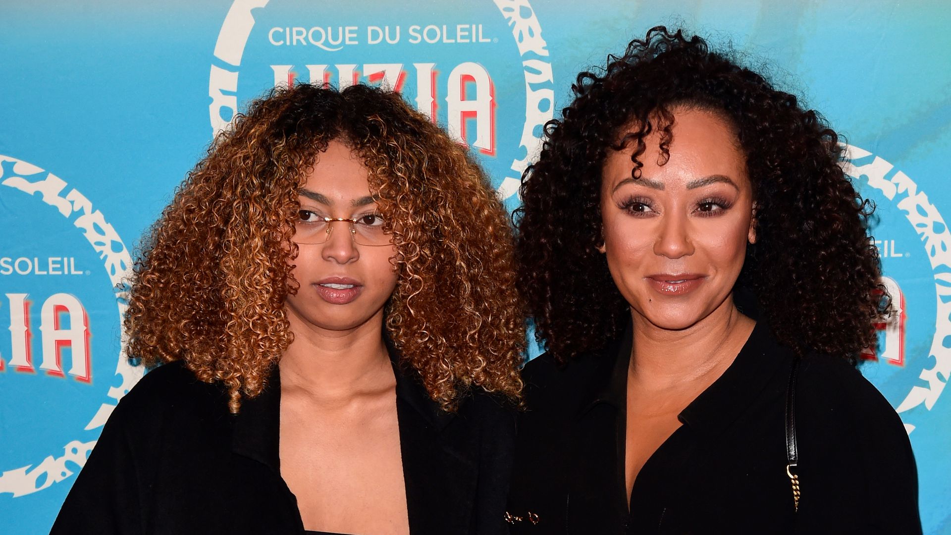 Phoenix Brown and Mel B on red carpet in black outfits