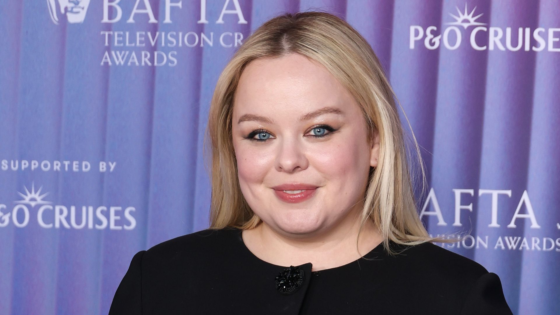 Nicola Coughlan attends the BAFTA Television and Television Craft Nominees' Party supported by P&O Cruises at The V&A on April 24 in a black mini dress and sheer tights look