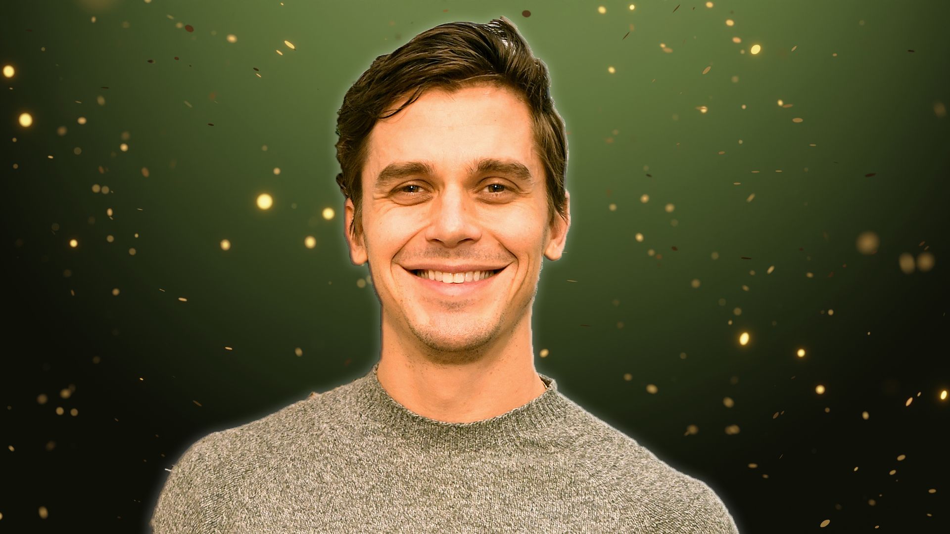 ANTONI POROWSKI IN FRONT OF A CHRISTMAS BACKGROUND 