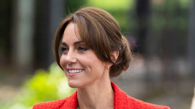 Princess Kate smiling in a red blazer