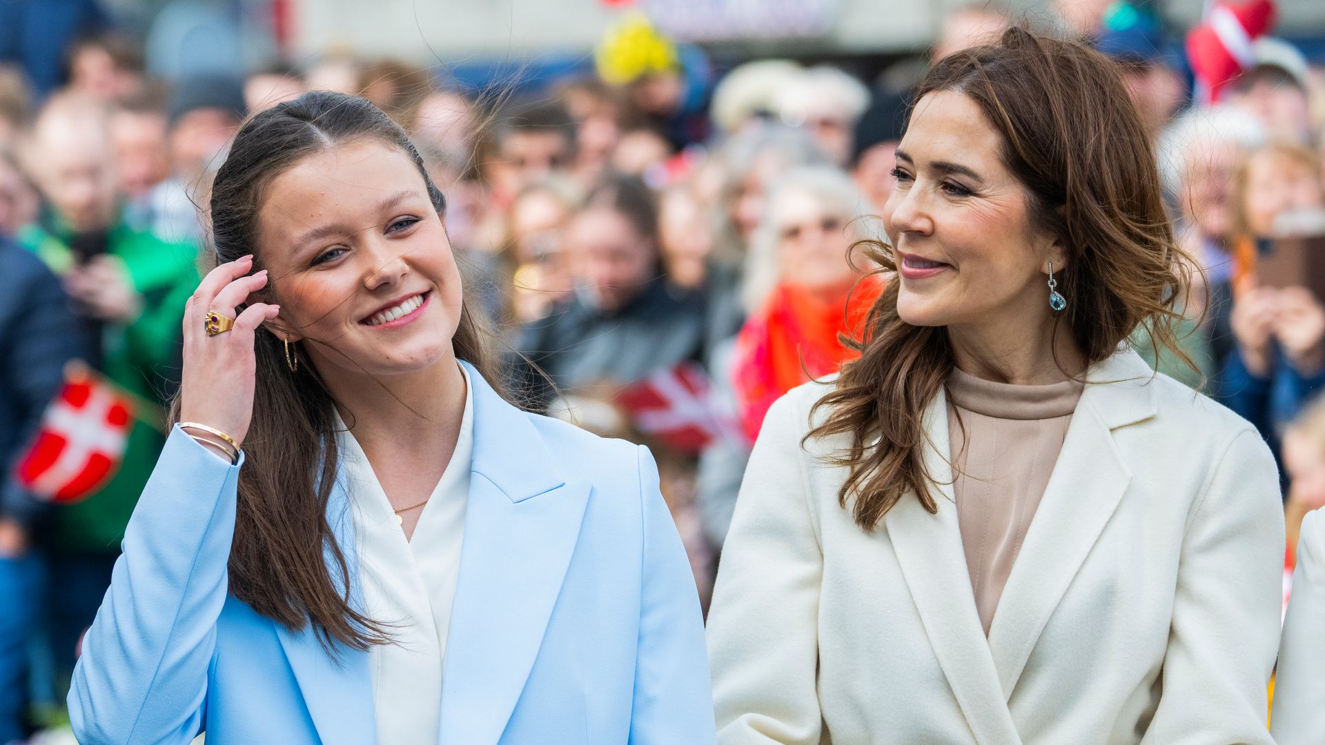 Queen Mary smiling at Princess Isabella in blue suit