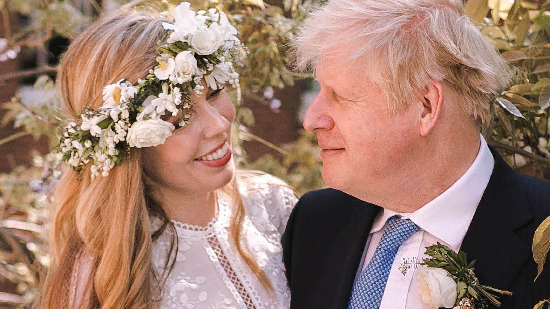 Boris Johnson's flower-clad bride Carrie grins in rare wedding photo