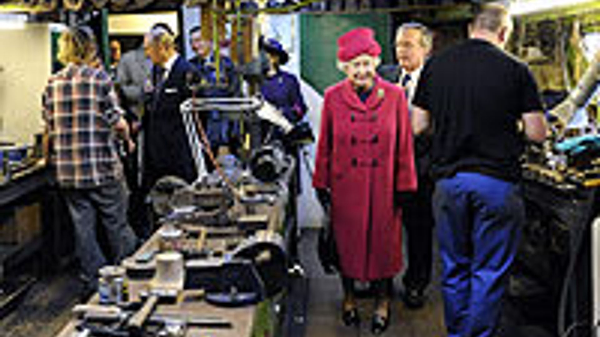 Mayor's wife breaks tradition to snap Queen at royal brolly makers