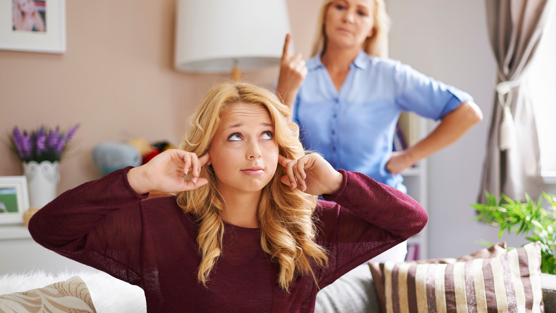 Blonde teenage girl rebelling against angry mother