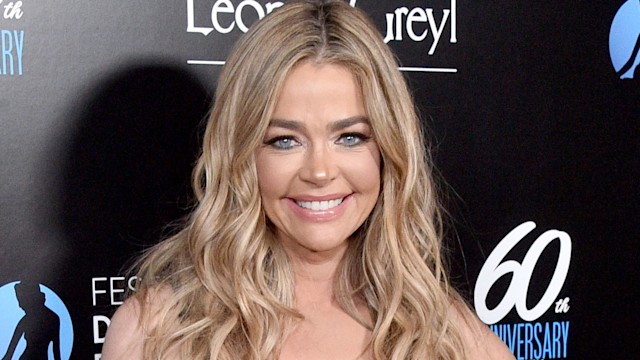 denise richards on red carpet in black tube dress 