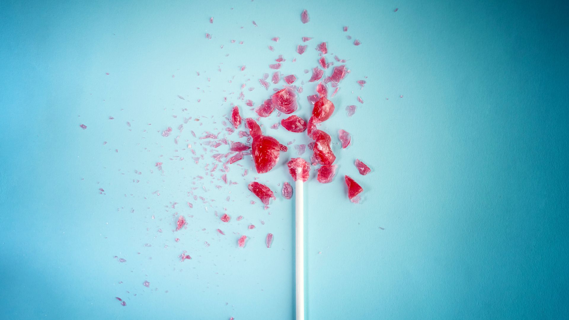 Lollipop exploding, unhealthy eating concept.