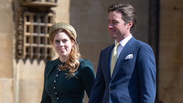 Princess Beatrice walks hand-in-hand with her husband Edoardo Mapelli Mozzi at Windsor Castle, wearing a green Beulah London dress and Mary Jane heels, paired with a gold headband and black Chanel bag.
