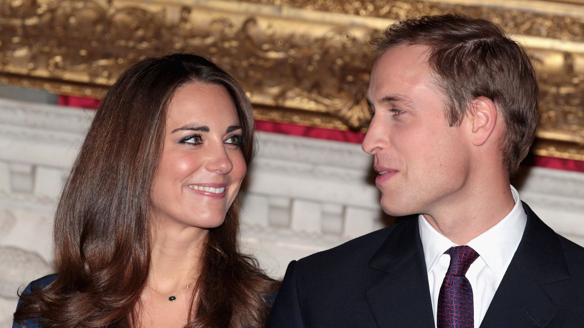 Prince William and Kate Middleton smile at eachother