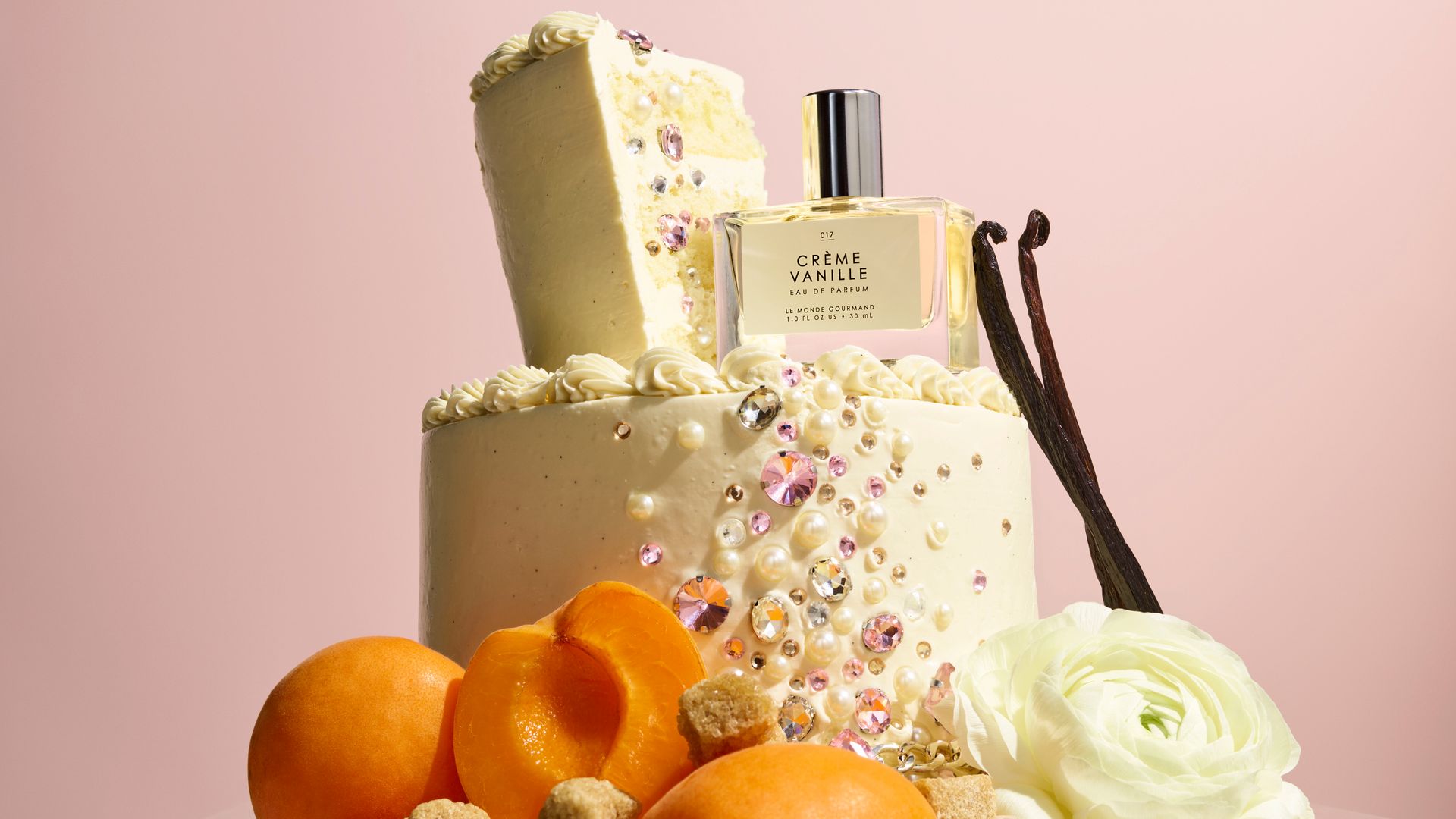 A Bottle of La Monde Gourman's Creme Vanille fragrance on a white cake 