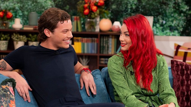 dianne buswell and bobby brazier chatting on sofa