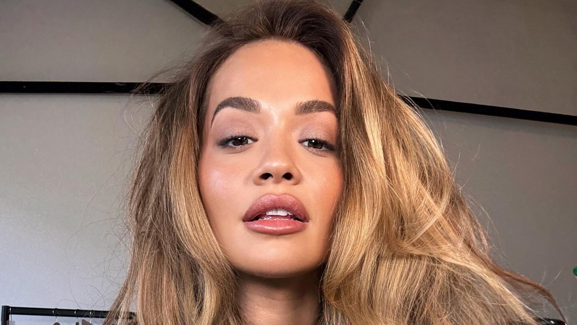 Rita Ora just styled bedazzled latex lingerie with sheer tights