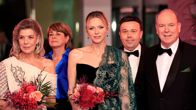 Princess Caroline of Hanover, Princess Charlene of Monaco and Prince's Albert II of Monaco pose during the 69th edition of the "Bal de la Rose" (Rose Ball) event at the Monte-Carlo Sporting Club in Monaco,