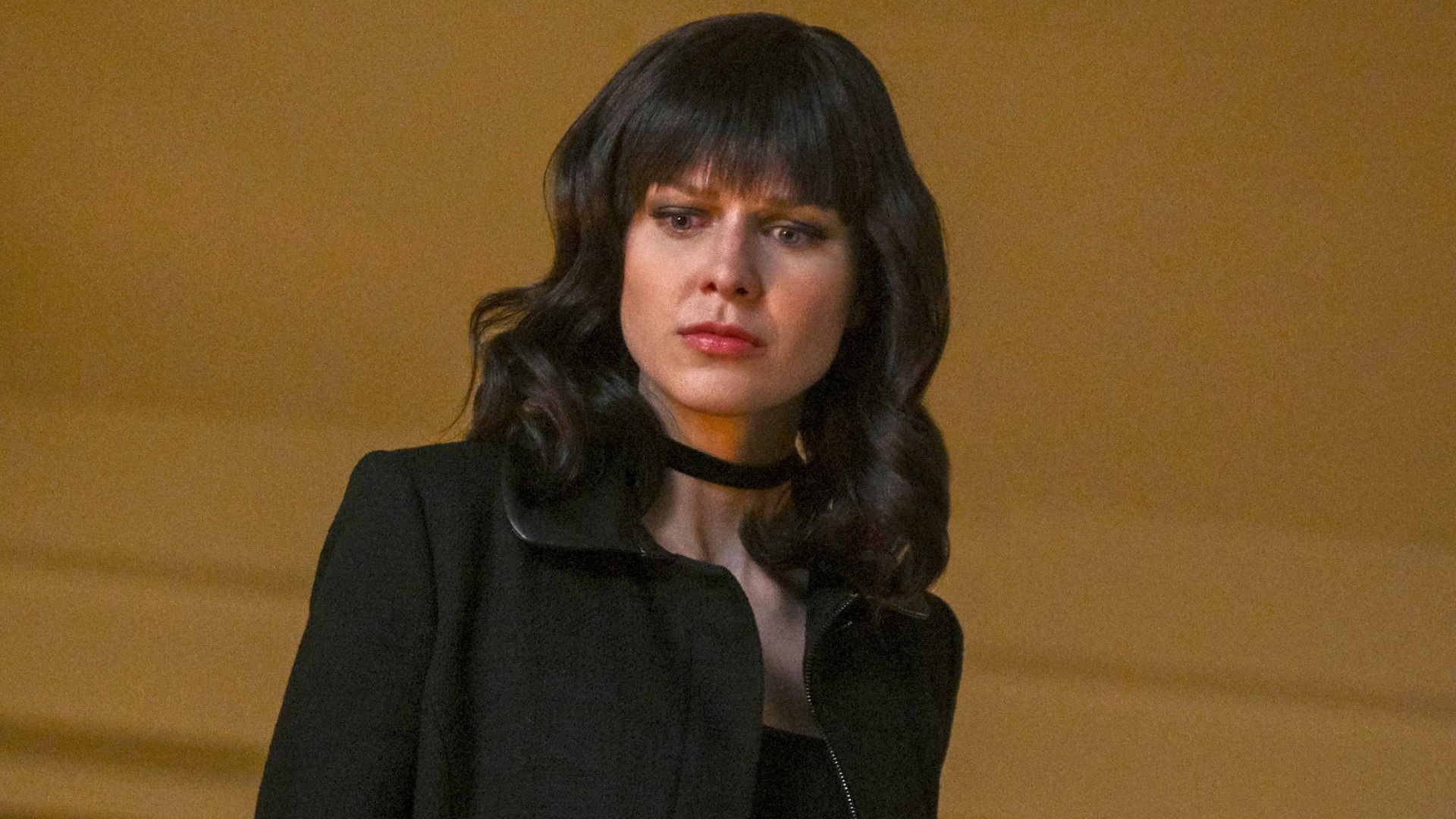 women with black hair and black jacket close-up