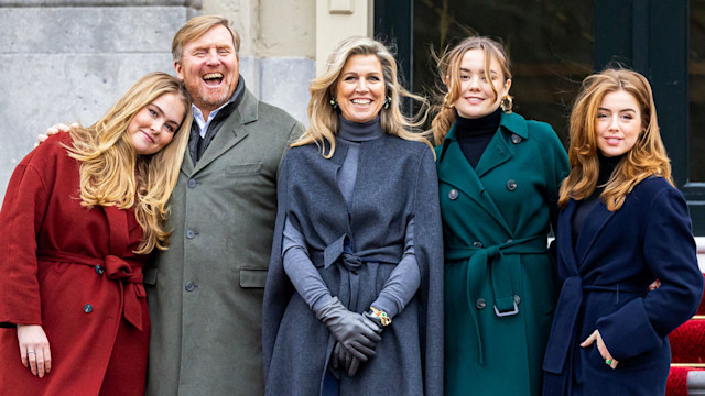 Princess Catharina-Amalia, King Willem-Alexander, Queen Maxima, Princess Ariane, Princess Alexia and a white dog on a set of stairs